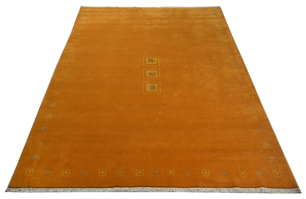 Handgeknüpfter tibeter Teppich in gold gelb mit Retro Bordüre – Neuwertig