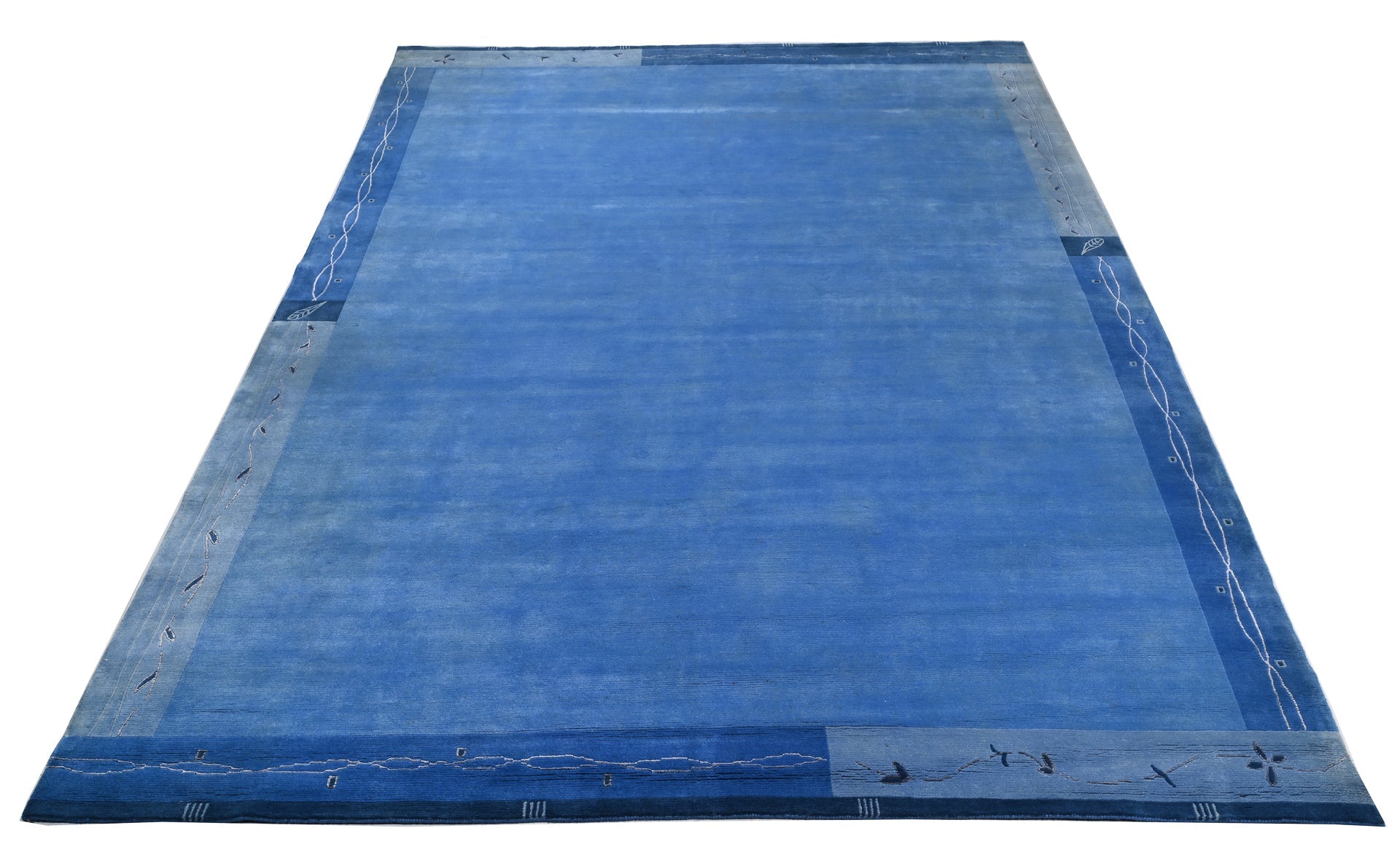 Handgeknüpfter tibetischer Teppich in blau mit Retro Bordüre – Neuwertig