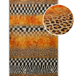 {"class" => "product-thumbnails__image", "alt" => "Detailaufnahme des Badteppichs Jungle Stripes mit vergrößerter Ansicht des Leopardenmusters und der Oberflächenstruktur."}