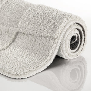 {"class" => "product-thumbnails__image", "alt" => "Badteppich von BathKing by WECONhome Davie Weiß aufgerollt auf hellem Hintergrund, Seitenansicht zeigt Florhöhe und Teppichkante"}
