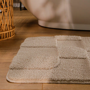 {"class" => "product-thumbnails__image", "alt" => "Badteppich von BathKing by WECONhome Davie Sand Beige runde Matte im Badezimmer vor Badewanne, Strukturmuster im Flor auf Holzboden sichtbar"}