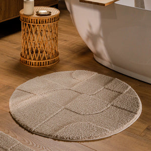 {"class" => "product-thumbnails__image", "alt" => "Runder Badteppich von BathKing by WECONhome Davie Sand Beige im Badezimmer vor Badewanne auf Holzboden, strukturiertes Linienrelief im Flor sichtbar"}