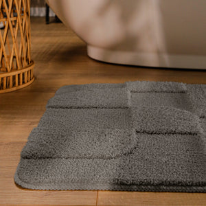{"class" => "product-thumbnails__image", "alt" => "Badteppich von BathKing by WECONhome Davie Basalt Grau runde Matte im Badezimmer vor Badewanne, Strukturmuster im Flor auf Holzboden sichtbar"}