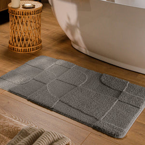 {"class" => "product-thumbnails__image", "alt" => "Badteppich von BathKing by WECONhome Davie Basalt Grau rechteckig im Badezimmer vor Badewanne auf Holzboden liegend, Strukturmuster im Flor sichtbar"}