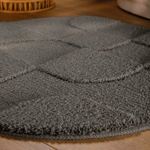 {"class" => "product-thumbnails__image", "alt" => "Badteppich von BathKing by WECONhome Davie Basalt Grau rund im Badezimmer auf Holzboden neben Badewanne, Florstruktur und Linienrelief erkennbar"}
