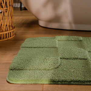 {"class" => "product-thumbnails__image", "alt" => "Badteppich von BathKing by WECONhome Davie Reseda Grün runde Matte im Badezimmer vor Badewanne, Strukturmuster im Flor auf Holzboden sichtbar"}