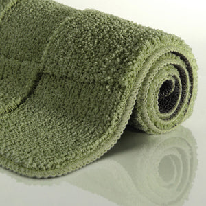 {"class" => "product-thumbnails__image", "alt" => "Badteppich von BathKing by WECONhome Davie Reseda Grün aufgerollt auf hellem Hintergrund, Seitenansicht zeigt Florhöhe und Teppichkante"}