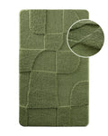 Badteppich von BathKing by WECONhome Davie Grün, Draufsicht mit Detailkreis der Florstruktur und eingeprägtem Muster auf weißem Hintergrund