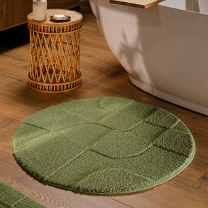 {"class" => "product-thumbnails__image", "alt" => "Runder Badteppich von BathKing by WECONhome Davie Reseda Grün im Badezimmer vor Badewanne auf Holzboden, strukturiertes Linienrelief im Flor sichtbar"}