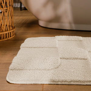 {"class" => "product-thumbnails__image", "alt" => "Badteppich von BathKing by WECONhome Davie Creme Weiß runde Matte im Badezimmer vor Badewanne, Strukturmuster im Flor auf Holzboden sichtbar"}