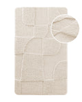 Badteppich von BathKing by WECONhome Davie Creme Weiß, Draufsicht mit Detailkreis der Florstruktur und eingeprägtem Muster auf weißem Hintergrund