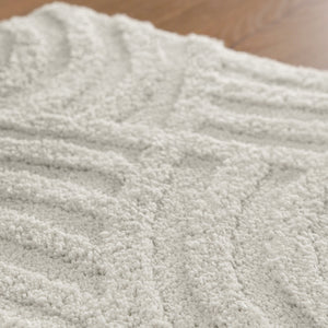 {"class" => "product-thumbnails__image", "alt" => "Badteppich von BathKing by WECONhome Fiete Weiß Nahaufnahme der Florstruktur, Linienrelief im dichten Teppichflor sichtbar"}