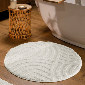 {"class" => "product-thumbnails__image", "alt" => "Runder Badteppich von BathKing by WECONhome Fiete Weiß im Badezimmer vor Badewanne auf Holzboden, strukturiertes Linienrelief im Flor sichtbar"}
