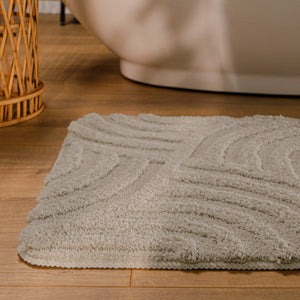 {"class" => "product-thumbnails__image", "alt" => "Badteppich von BathKing by WECONhome Fiete Grau runde Matte im Badezimmer vor Badewanne, Strukturmuster im Flor auf Holzboden sichtbar"}