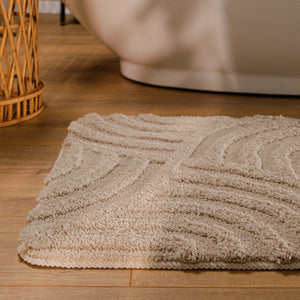 {"class" => "product-thumbnails__image", "alt" => "Badteppich von BathKing by WECONhome Fiete Sand Beige runde Matte im Badezimmer vor Badewanne, Strukturmuster im Flor auf Holzboden sichtbar"}