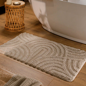 {"class" => "product-thumbnails__image", "alt" => "Badteppich von BathKing by WECONhome Fiete Sand Beige rechteckig im Badezimmer vor Badewanne auf Holzboden liegend, Strukturmuster im Flor sichtbar"}