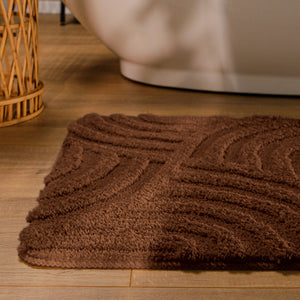 {"class" => "product-thumbnails__image", "alt" => "Badteppich von BathKing by WECONhome Fiete Braun runde Matte im Badezimmer vor Badewanne, Strukturmuster im Flor auf Holzboden sichtbar"}