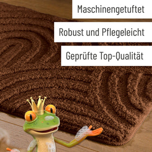 {"class" => "product-thumbnails__image", "alt" => "Badteppich von BathKing by WECONhome Fiete Braun Detail der Teppichkante auf Holzfußboden, eingeblendete Hinweise zu Verarbeitung und Pflege"}