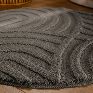 {"class" => "product-thumbnails__image", "alt" => "Badteppich von BathKing by WECONhome Fiete Basalt Grau rund im Badezimmer auf Holzboden neben Badewanne, Florstruktur und Linienrelief erkennbar"}