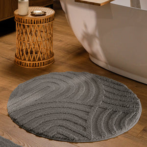 {"class" => "product-thumbnails__image", "alt" => "Runder Badteppich von BathKing by WECONhome Fiete Basalt Grau im Badezimmer vor Badewanne auf Holzboden, strukturiertes Linienrelief im Flor sichtbar"}