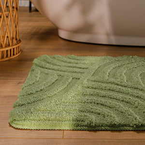 {"class" => "product-thumbnails__image", "alt" => "Badteppich von BathKing by WECONhome Fiete Reseda Grün runde Matte im Badezimmer vor Badewanne, Strukturmuster im Flor auf Holzboden sichtbar"}