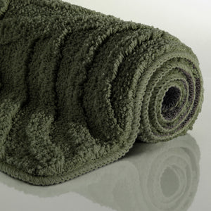 {"class" => "product-thumbnails__image", "alt" => "Badteppich von BathKing by WECONhome Fiete Kiefer Grün aufgerollt auf hellem Hintergrund, Seitenansicht zeigt Florhöhe und Teppichkante"}