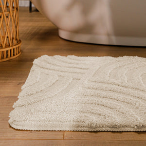 {"class" => "product-thumbnails__image", "alt" => "Badteppich von BathKing by WECONhome Fiete Creme Weiß runde Matte im Badezimmer vor Badewanne, Strukturmuster im Flor auf Holzboden sichtbar"}