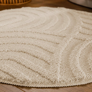 {"class" => "product-thumbnails__image", "alt" => "Badteppich von BathKing by WECONhome Fiete Creme Weiß rund im Badezimmer auf Holzboden neben Badewanne, Florstruktur und Linienrelief erkennbar"}