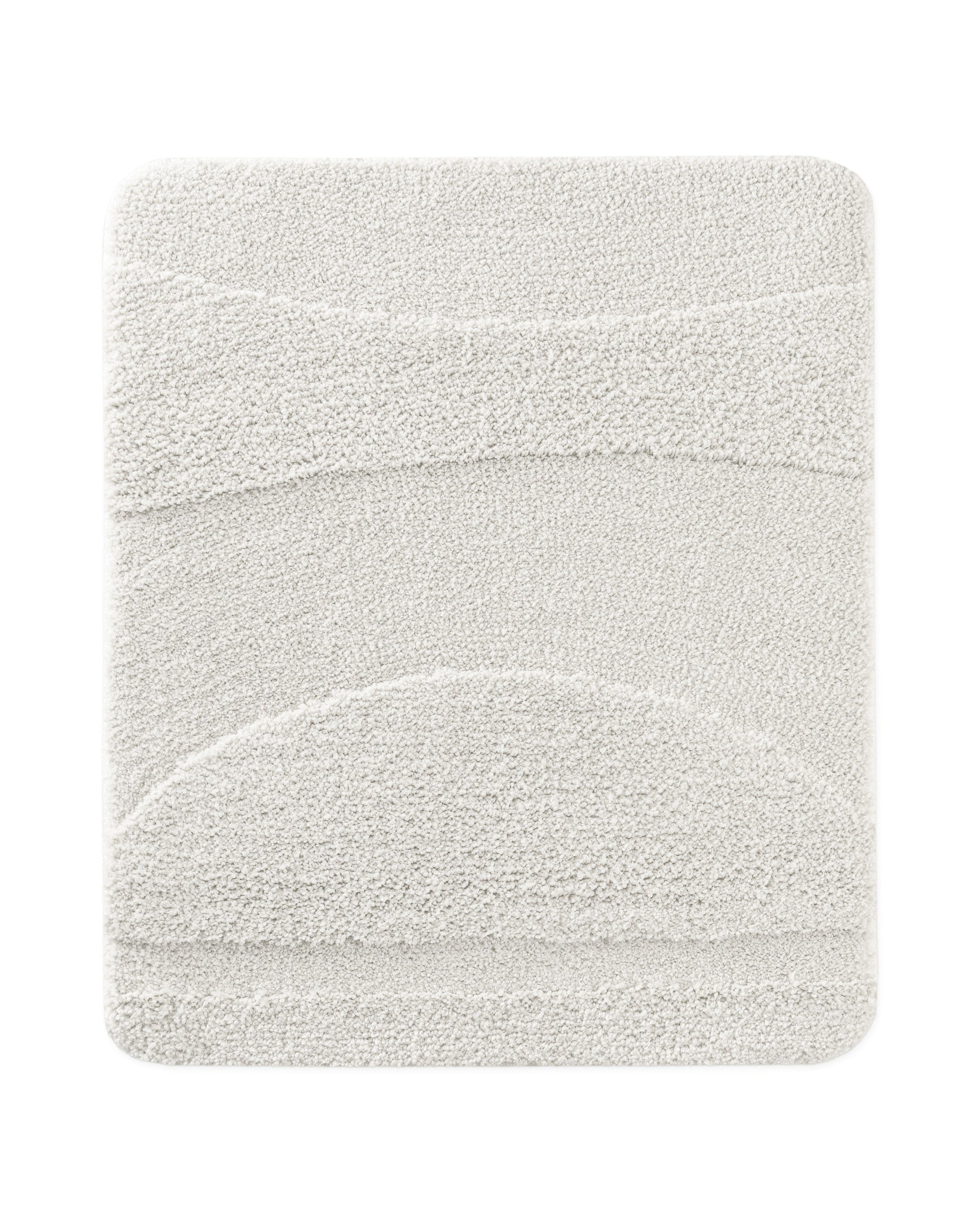 Badteppich von BathKing by WECONhome Marc Weiß rechteckig 55x65 cm, Draufsicht auf Matte mit eingeprägtem Linienmuster auf hellem Hintergrund