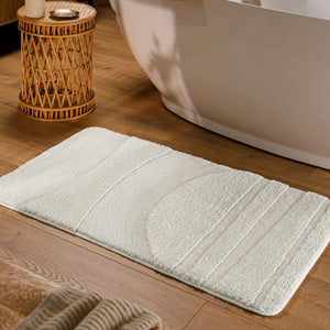 {"class" => "product-thumbnails__image", "alt" => "Badteppich von BathKing by WECONhome Marc Weiß rechteckig im Badezimmer vor Badewanne auf Holzboden liegend, Strukturmuster im Flor sichtbar"}