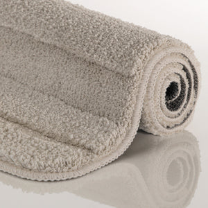 {"class" => "product-thumbnails__image", "alt" => "Badteppich von BathKing by WECONhome Marc Grau aufgerollt auf hellem Hintergrund, Seitenansicht zeigt Florhöhe und Teppichkante"}