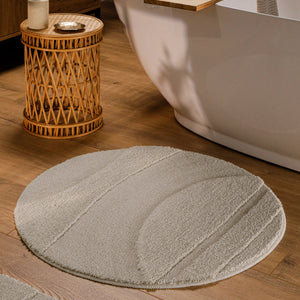 {"class" => "product-thumbnails__image", "alt" => "Runder Badteppich von BathKing by WECONhome Marc Grau im Badezimmer vor Badewanne auf Holzboden, strukturiertes Linienrelief im Flor sichtbar"}
