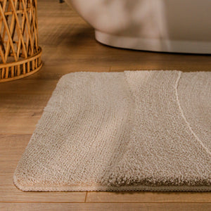 {"class" => "product-thumbnails__image", "alt" => "Badteppich von BathKing by WECONhome Marc Sand Beige runde Matte im Badezimmer vor Badewanne, Strukturmuster im Flor auf Holzboden sichtbar"}
