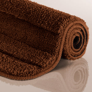{"class" => "product-thumbnails__image", "alt" => "Badteppich von BathKing by WECONhome Marc Braun aufgerollt auf hellem Hintergrund, Seitenansicht zeigt Florhöhe und Teppichkante"}