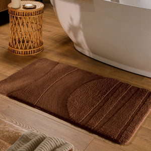 {"class" => "product-thumbnails__image", "alt" => "Badteppich von BathKing by WECONhome Marc Braun rechteckig im Badezimmer vor Badewanne auf Holzboden liegend, Strukturmuster im Flor sichtbar"}
