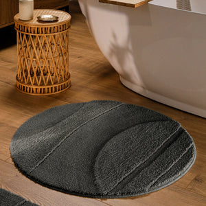 {"class" => "product-thumbnails__image", "alt" => "Runder Badteppich von BathKing by WECONhome Marc Anthrazit Grau im Badezimmer vor Badewanne auf Holzboden, strukturiertes Linienrelief im Flor sichtbar"}