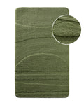 Badteppich von BathKing by WECONhome Marc Grün, Draufsicht mit Detailkreis der Florstruktur und eingeprägtem Muster auf weißem Hintergrund