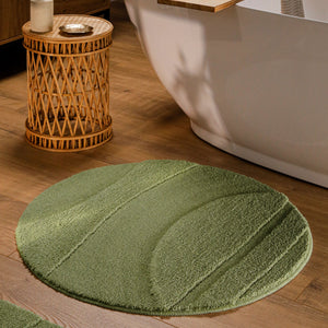 {"class" => "product-thumbnails__image", "alt" => "Runder Badteppich von BathKing by WECONhome Marc Reseda Grün im Badezimmer vor Badewanne auf Holzboden, strukturiertes Linienrelief im Flor sichtbar"}