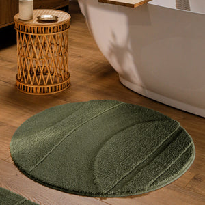 {"class" => "product-thumbnails__image", "alt" => "Runder Badteppich von BathKing by WECONhome Marc Kiefer Grün im Badezimmer vor Badewanne auf Holzboden, strukturiertes Linienrelief im Flor sichtbar"}