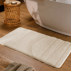 {"class" => "product-thumbnails__image", "alt" => "Badteppich von BathKing by WECONhome Marc Creme Weiß rechteckig im Badezimmer vor Badewanne auf Holzboden liegend, Strukturmuster im Flor sichtbar"}