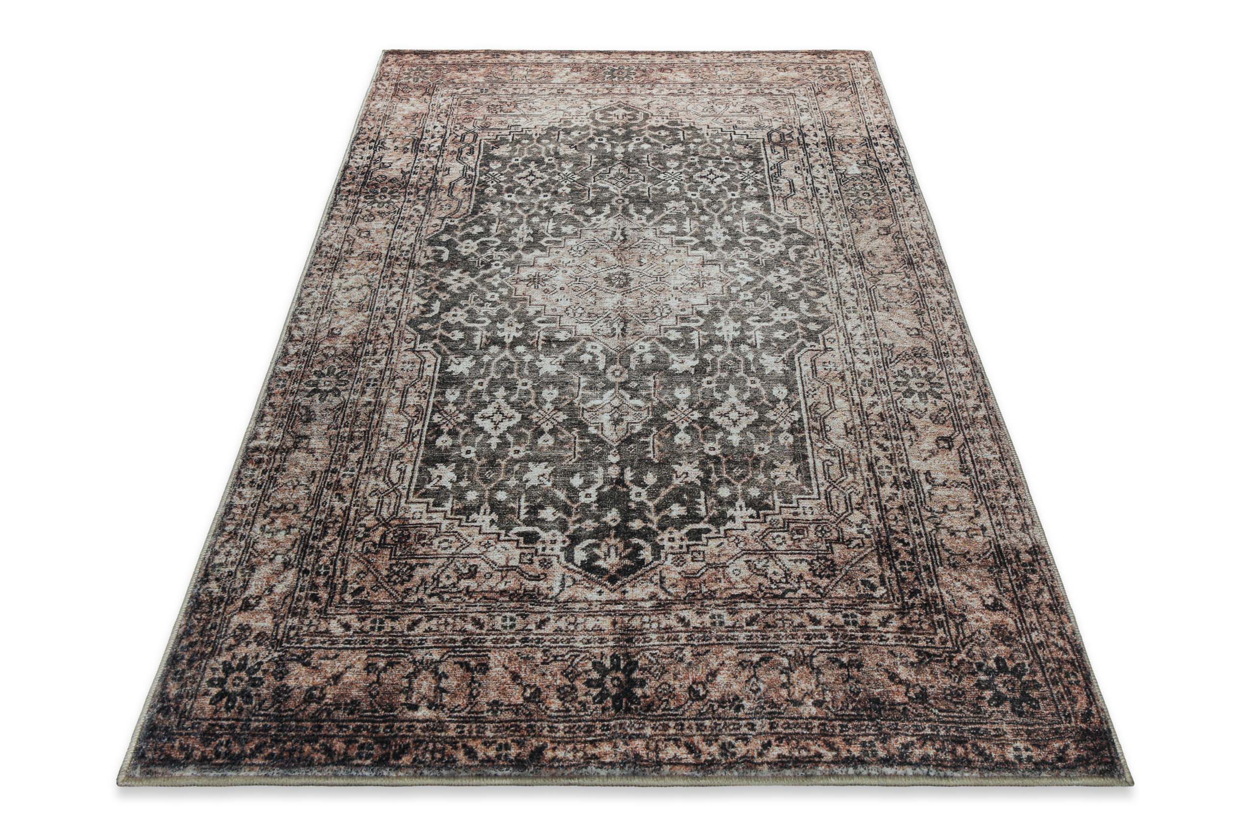 Beige-grauer Vintage-Badteppich Ralph in perspektivischer Ansicht mit dekorativem Ethno-Design.