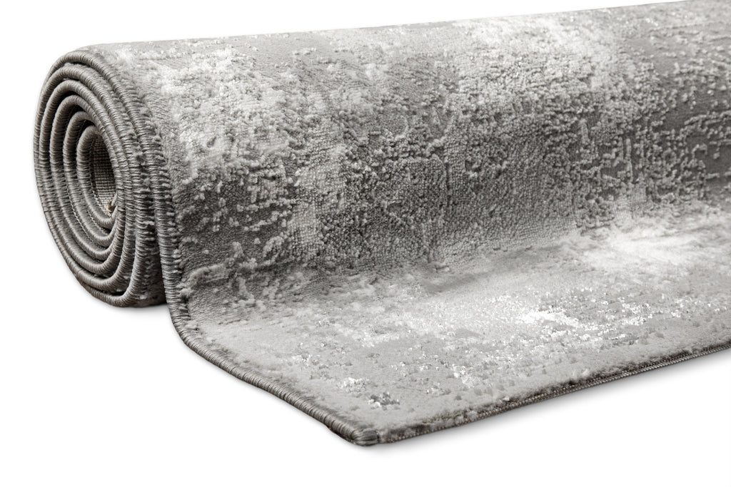 Esprit Feel Vintage 2.0 Teppich Grau Silber gerollt, zeigt Flexibilität und Materialstärke