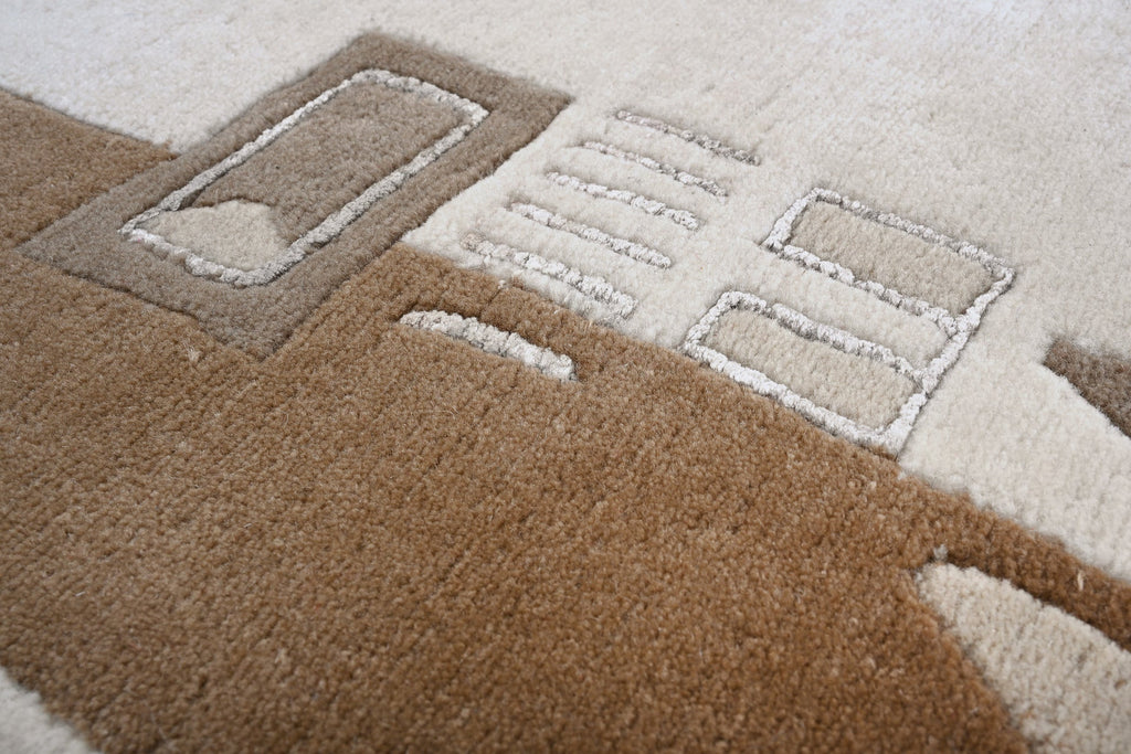 Handgeknüpfter Tibet Teppich in beige mit schmaler Retro Bordüre – Neuwertig