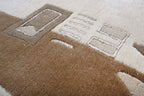 Handgeknüpfter Tibet Teppich in beige mit schmaler Retro Bordüre – Neuwertig