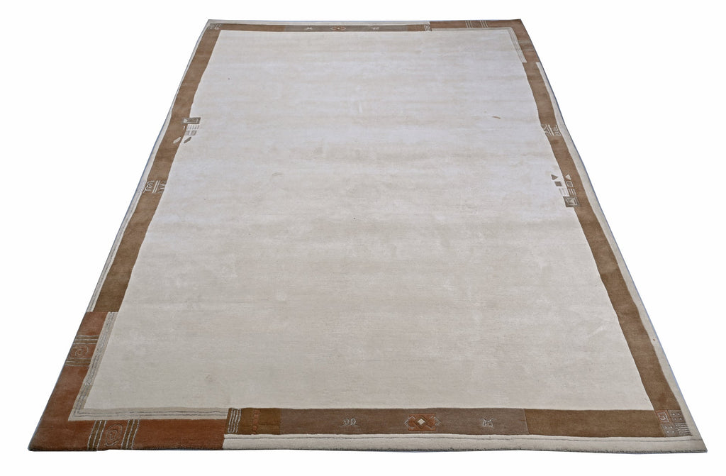 Handgeknüpfter Tibet Teppich in beige mit schmaler Retro Bordüre – Neuwertig
