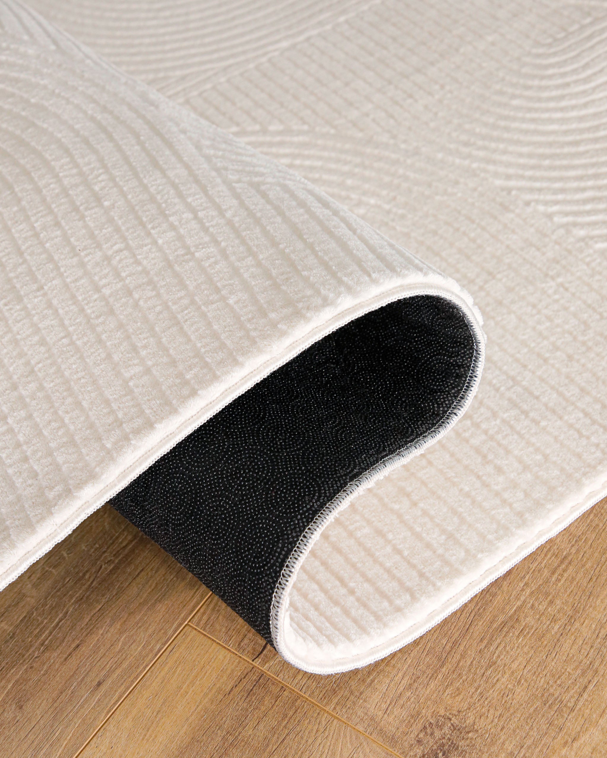 Detailansicht WECONhome Kurzflorteppich Nuuk Arc in Creme Weiß Antirutschrücken