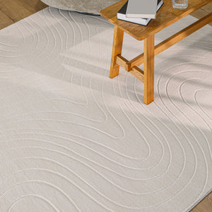 {"class" => "product-thumbnails__image", "alt" => "Nuuk Flow Teppich creme-weiß in hellem Wohnzimmer unter einem Holztisch und Hocker"}