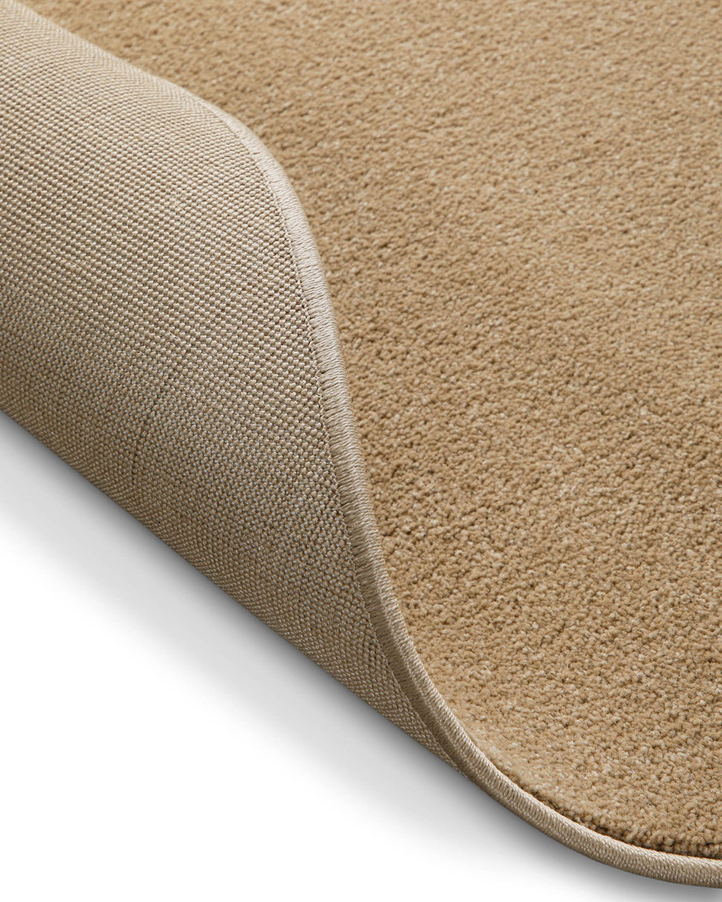 Umgeschlagene Ecke mit sichtbarer Rückseite, zeigt Materialaufbau und Verarbeitung