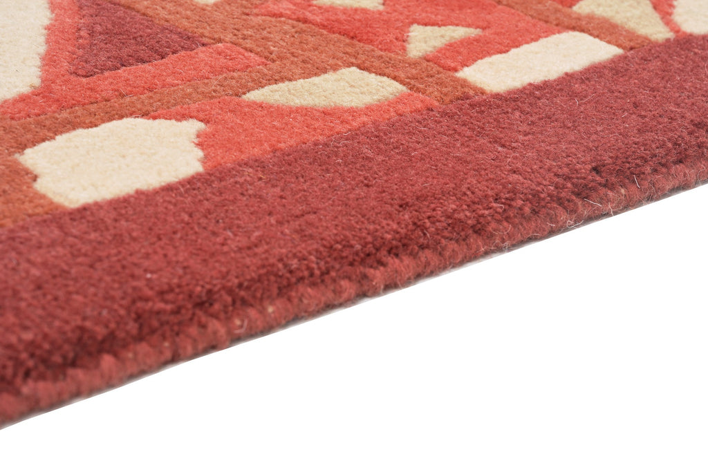 Handgeknüpfter tibetischer Teppich in rot mit Retro Bordüre – Neuwertig