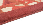 Handgeknüpfter tibetischer Teppich in rot mit Retro Bordüre – Neuwertig